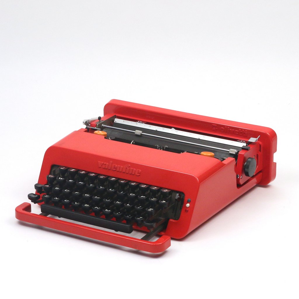 ETTORE SOTTSASS 'VALENTINE S' TYPEWRITER: appears in good condition. Scratches on enameled metal of typewriter above keyboard area and on case.Ettore Sottsass "Valentine S" typewriter mfd. by Olivetti - Italy, 1969 plastic, enameled metal, ru