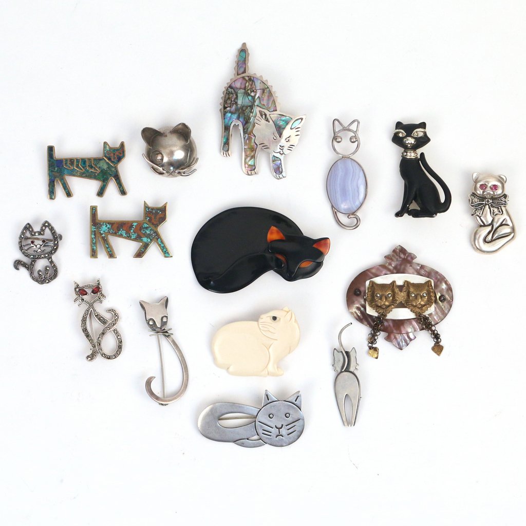 (15pc) LOT OF CAT FORM PINS: Including a large black cat pin by Lea Stein - Paris, a carved bone pin singed "AN"; six Mexican cat pins, some marked sterling, plus several other cat form pins of varying size and material. Size ran