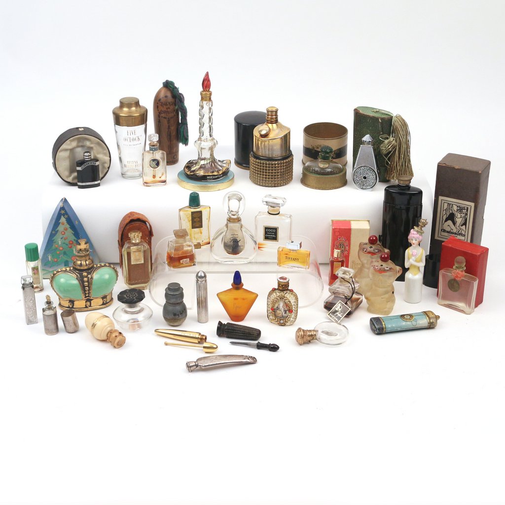 COLLECTION OF ANTIQUE AND VINTAGE PERFUME BOTTLES: Including a bottle of "First" by Van Cleef & Arpels; a green crown-form "Princematchabelli" bottle; and various other pieces height range 1-1/2 to 6 in.