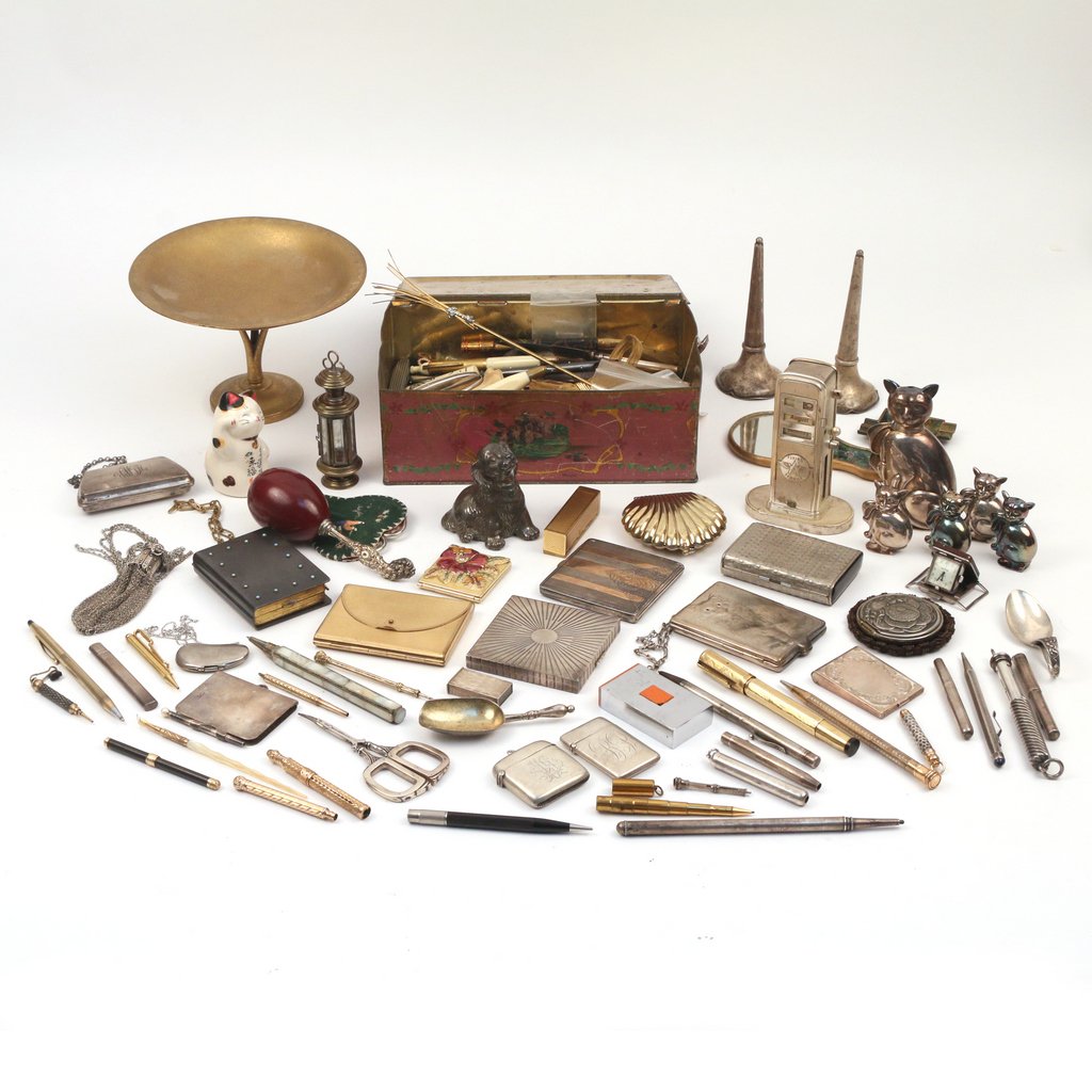 MISC. LOT OF ACCESSORIES AND DRESSING ITEMS: Including a Tiffany Studioes round gilt bronze compote, several lady's compacts, coin purses, matchboxes, travel clocks, pens & pencils et. al. several pieces in silver