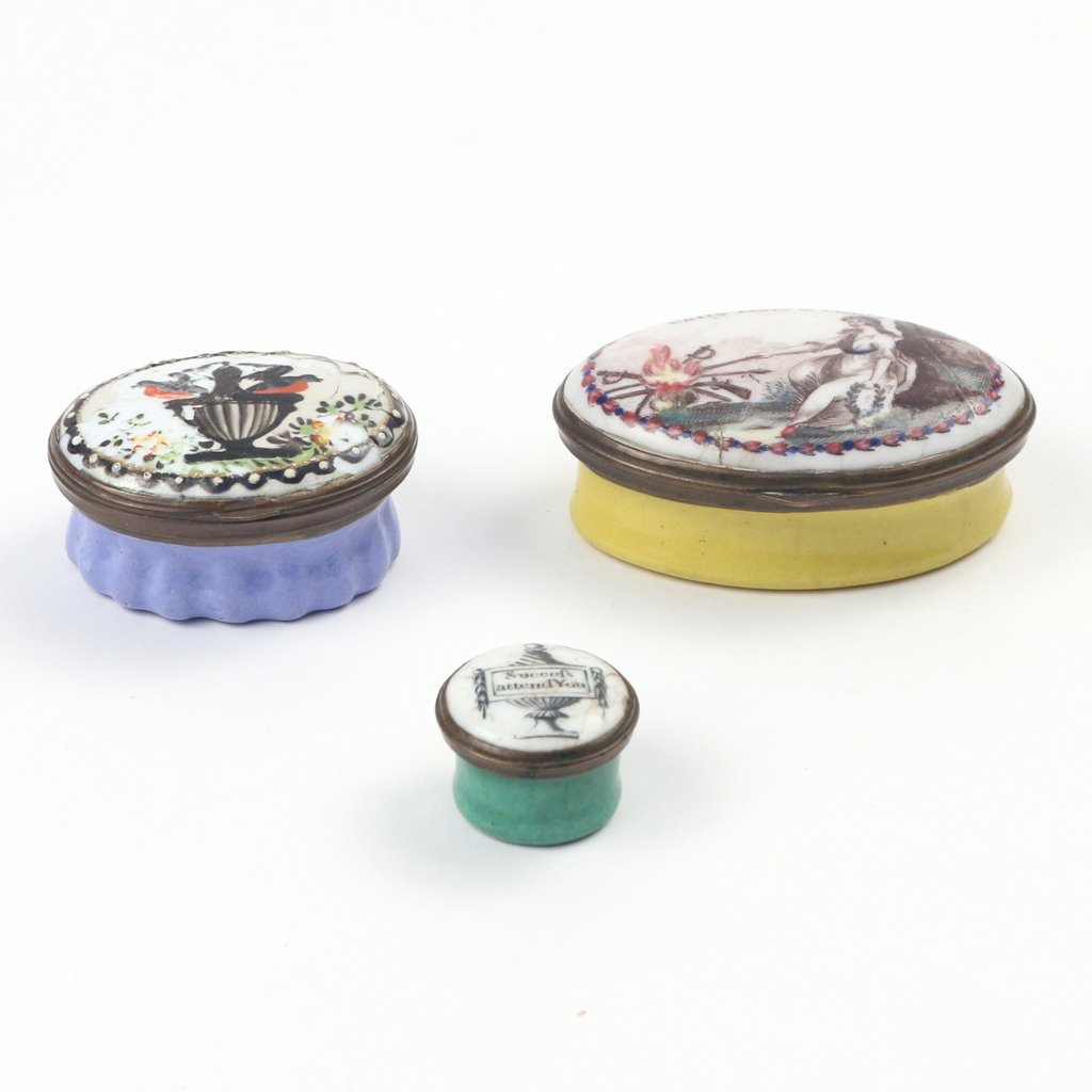 (3pc) PORCELAIN PATCH BOXES: (3pc) PORCELAIN PATCH BOXESIncluding one with a scene of a victory figure titled 'Unity, Peace & Plenty', 2-1/4 in.; one with an urn scene (heavily damaged), and a very small round box