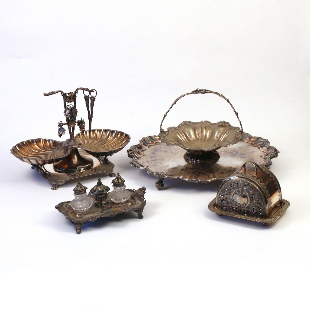 (5pc) VICTORIAN ROCOCO SILVER PLATE: (5pc) VICTORIAN ROCOCO SILVER PLATEincluding an epergne on stand, H. 13 in. w/grape scissors ; a basket with handle, h. 10 in.; and a covered Stilton cheese dish, h. 15 in.; footed stand, dia. 23 in, 
