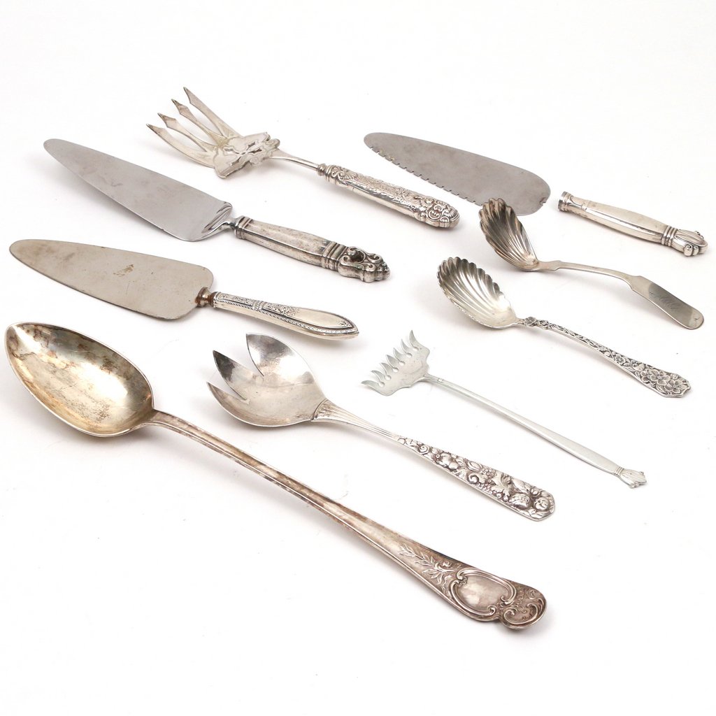 (9pc) SILVER SERVING PIECES: (9pc) SILVER SERVING PIECESIncluding a long English silver stuffing spoon, 13-1/2 in; a scallop shell sugar scoop, 6-1/2 in; a scallop shell ladle, 6 in; a three-pronged serving fork, 8-1/2 in.; a sar