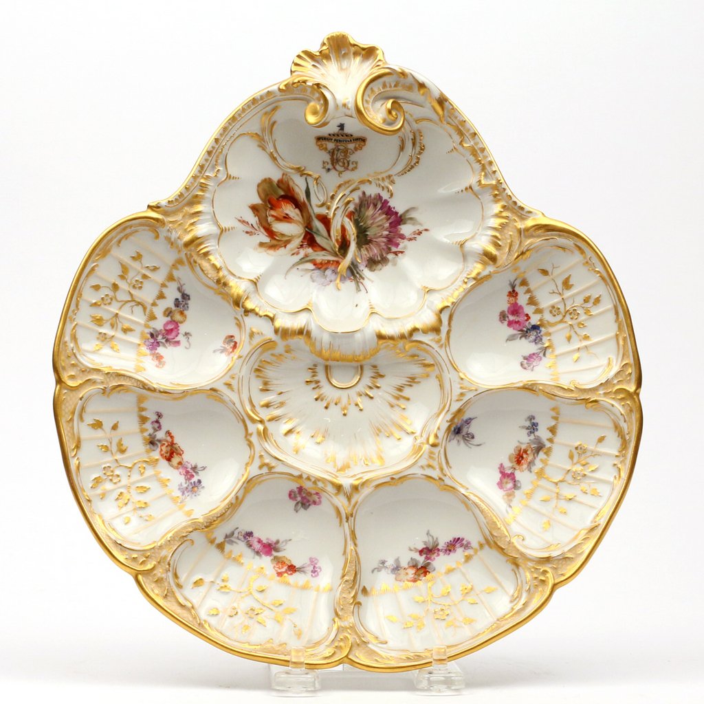KPM PORCELAIN ARMORIAL OYSTER PLATE: with six wells and a crested monogram with the motto 'Spernit Pericula Virtus' (Excellence scorns danger), 10-1/2 x 9-1/2 in.