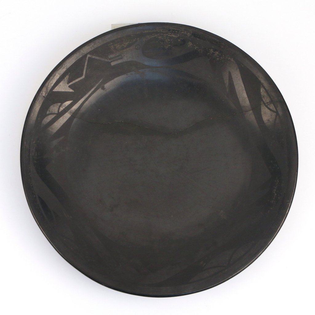 SAN ILDEFONSO BLACK ON BLACK POTTERY CHARGER: Sgd. Maria & Santana, charger w/serpent border, dia 14 3/4" neat crack through lower 3rd. (needs to be glued)