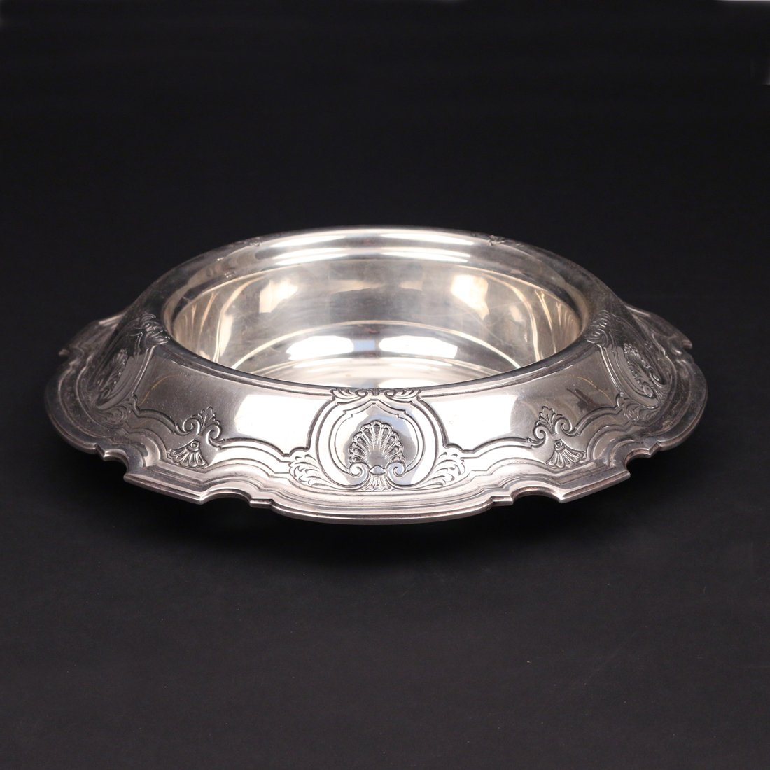 TIFFANY & CO. STERLING SILVER CENTRE BOWL: having a deep bowl and engraved everted rim w/sheel design, H. 2 ¾”, dia. 12 ¼”, wgt. Approx.. 31 toz,
