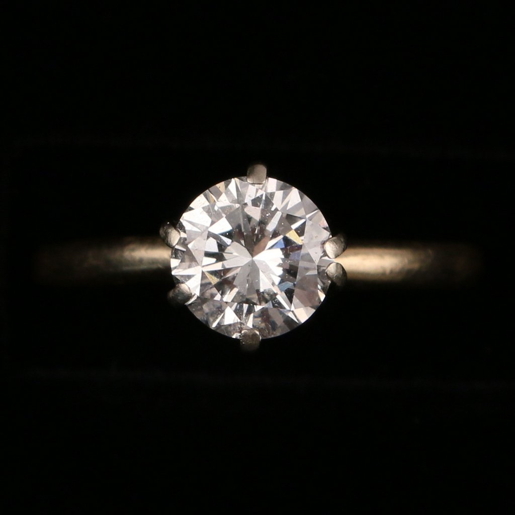 DIAMOND AND GOLD ENGAGEMENT RING: A 14k solitaire ring having a prong-set round brilliant diamond, appx. 1.05ct**, SI, G-H color; size 6, total weight 2.2g