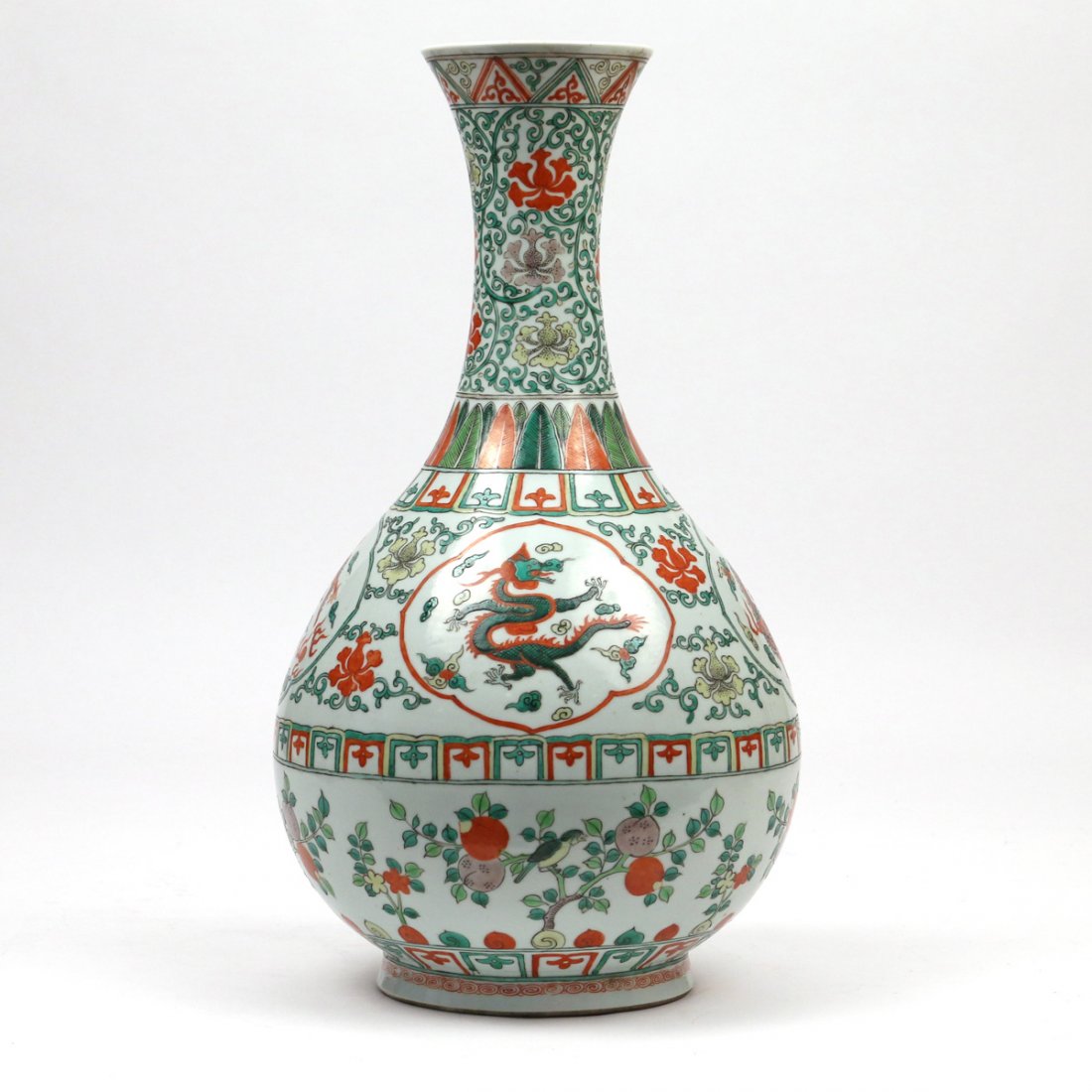 CHINESE FAMILLE VERTE PORCELAIN 'DRAGON' VASE: 19th/early 20th Century, of bottle shape, with a central band having four dragons in reserves among lotus scrolls and other archaic motifs, with partial apocryphal Ming dynasty reign mark in underglaz