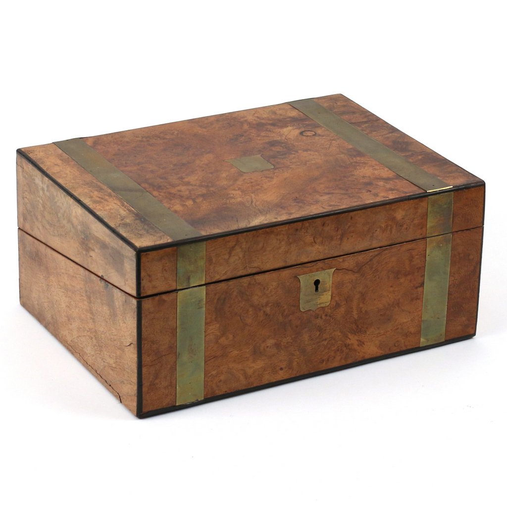 REGENCY WALNUT TRAVEL WRITING BOX: With tan leather writing surface, brass banding and brass escutcheon; h.5-1/2 w.11-3/4 d.8-3/4in.