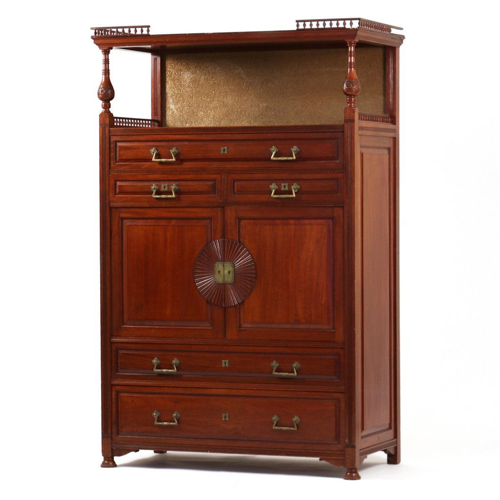 BRANDED HERTER BROTHERS CABINET: C. 1880, A Japonesque aesthetic period cherrywood cabinet having a partial gallery pediment over an open shelf with original gilt backboard fabric and carved ring turned balustrade frontal supports wi