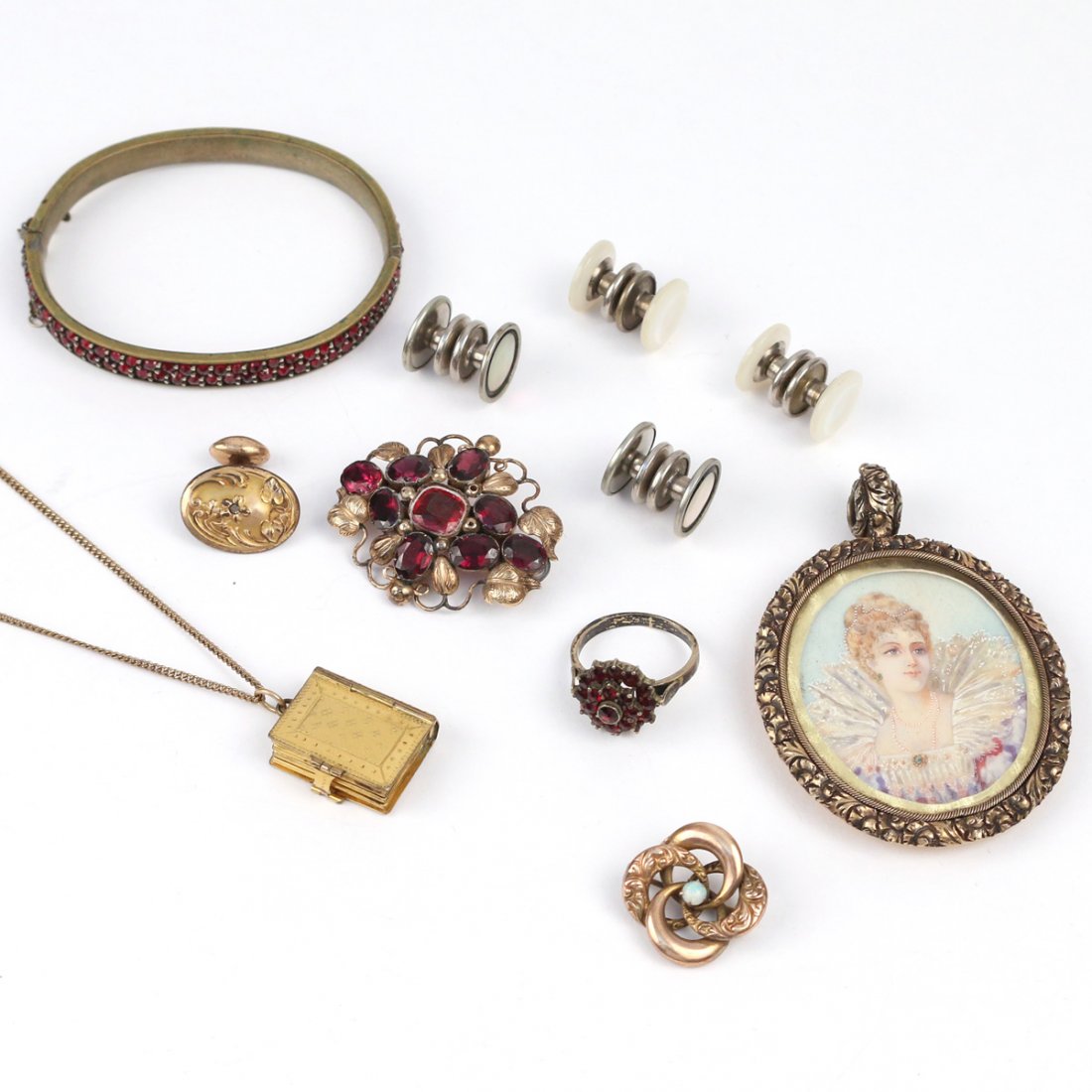 (11pc) GOLD PLATED AND OTHER JEWELRY: Including a Victorian portrait pendant, a garnet cluster ring and garnet hard bracelet, two pairs of mother-of-pearl snap cufflinks, one single art-nouveau cufflink, a gemstone pin, a pendant photo al