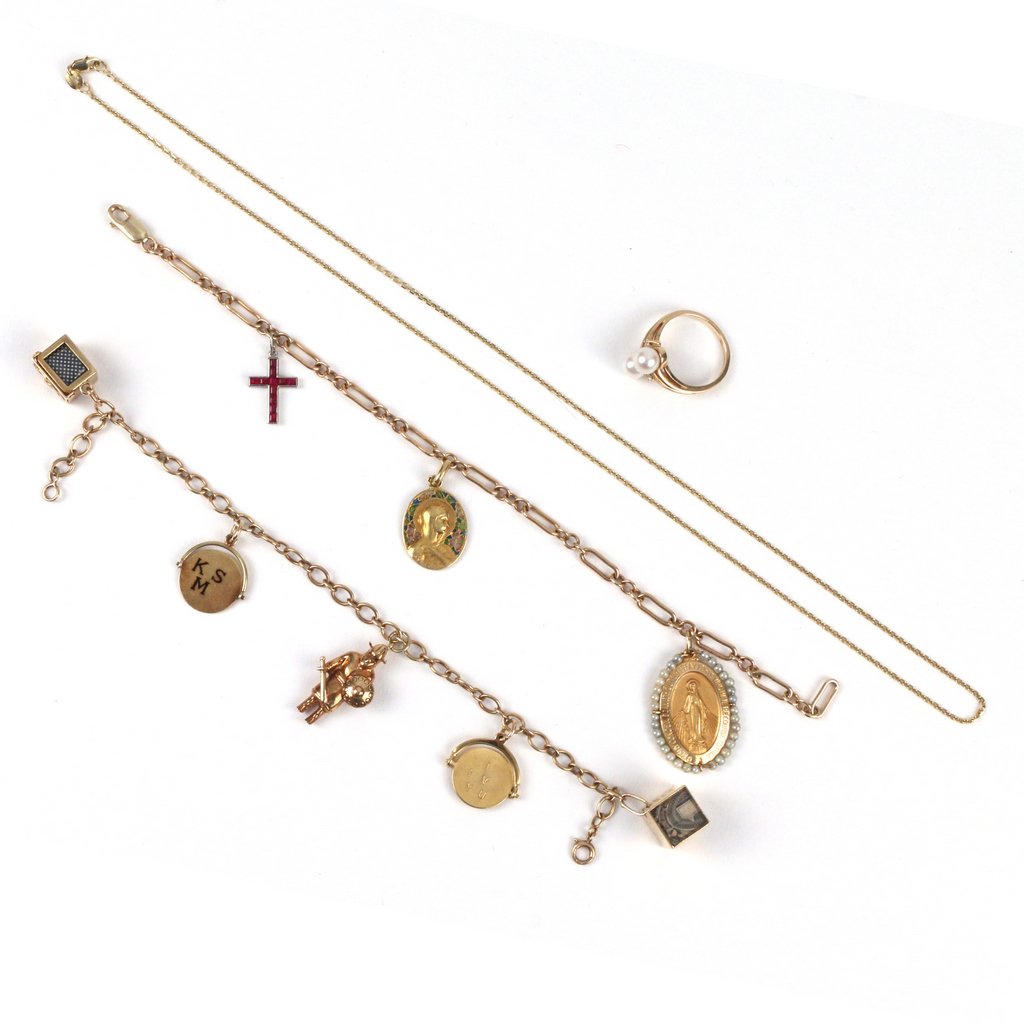 (4pc) GOLD CHARM BRACELETS AND OTHER: Including a 14k chain with 3 charms: a Tiffany & Co. colored stone cross, a French gold plique-a-jour Mary Magdeline signed "F. Vernon," and a 14k Virgin Mary bordered in seed pearls, (l. 8in.) ; a 14