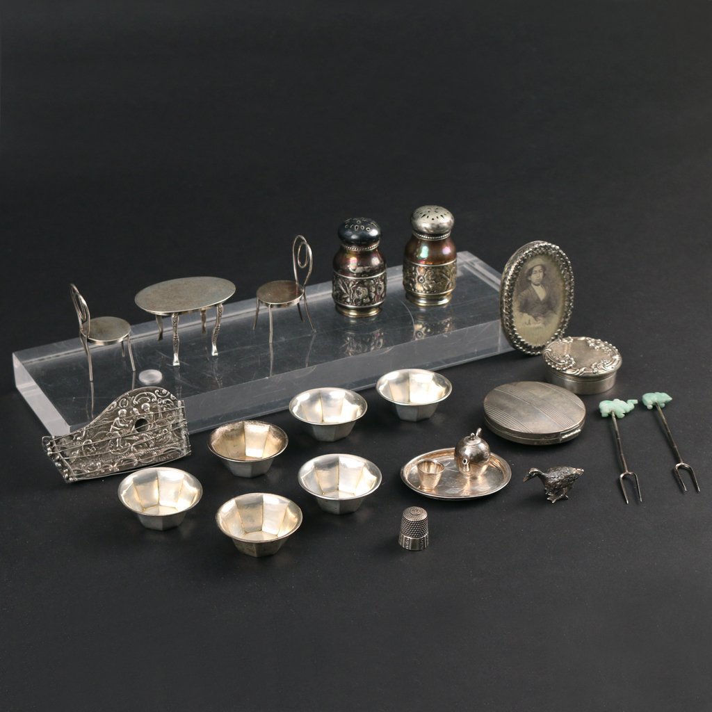(23pc) MISC. SMALL SILVER ITEMS: including a doll-house round table with two chairs; a doll-house 4-piece tea set; a miniature harpsichord; a thimble; duck; pill box; picture frame; a compact; 6 salt cellars; 2 Gorham salt and pepper