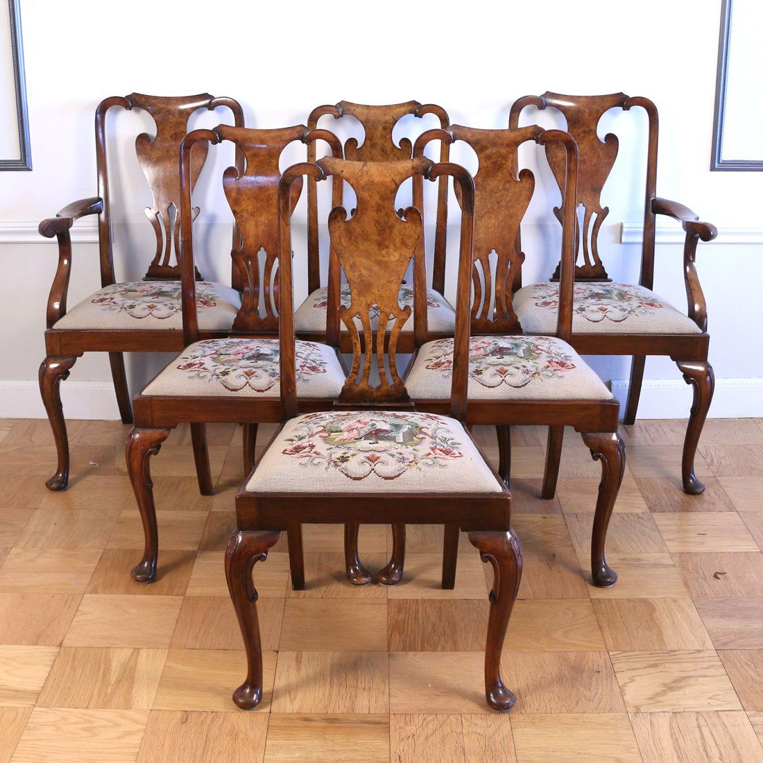 (9pc) QUEEN ANNE STYLE DINING SET: Including 6 chairs (Two armchairs and four sidechairs with urn shaped paint decorated splats, needlepoint slip seats with scenes; h.39-1/2) a dining table (Having an oval top plus two leaves, cabriole