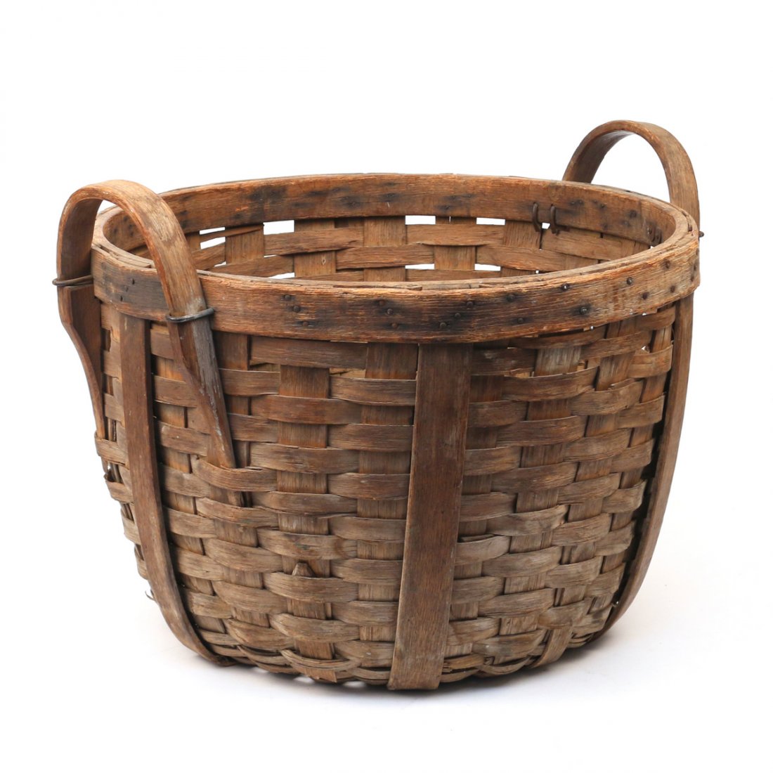 HICKORY WOVEN APPLE BASKET: Having heavy hickory strapping supports connecting a stapled hickory rim with bentwood handles; h.15 x dia. 20 in.