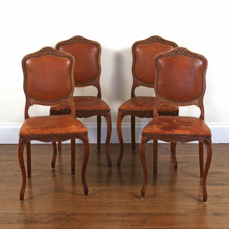(4pc) FRENCH PROVINCIAL WALNUT SIDE CHAIRS: 20th Century, with distressed brown leather upholstery, h. 37 w. 18 d. 19 in.