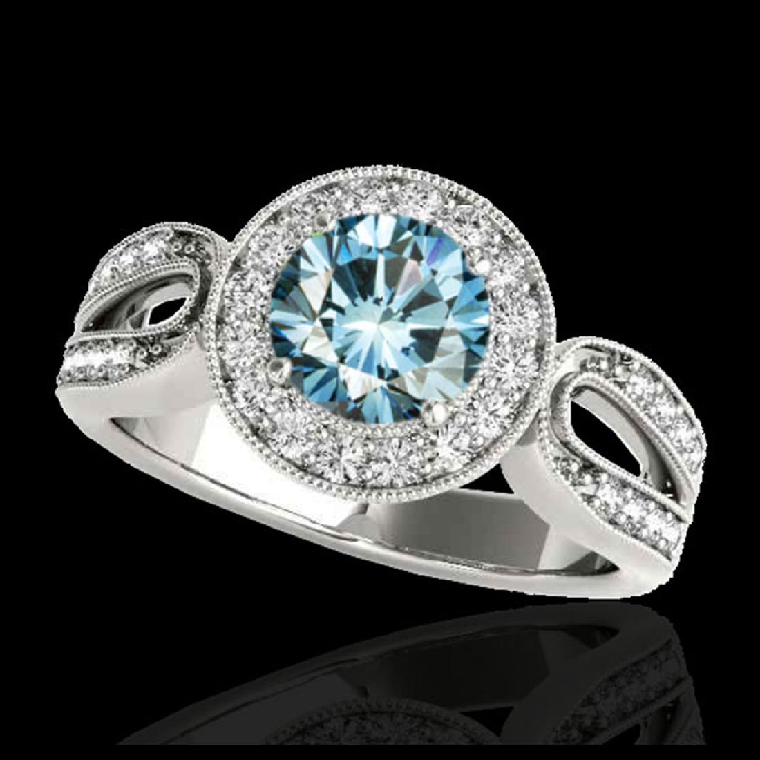 1.40 ctw SI Fancy Blue Diamond Solitaire Halo Ring 10K: REF-130A6V - SKU:34563 ---- 1.40 ctw SI Fancy Blue Diamond Solitaire Halo Ring 10K White Gold Designer Brand Luxury Jewelry, made in the USA Suggested Retail Price: $10,550 Factory offers perfect fact