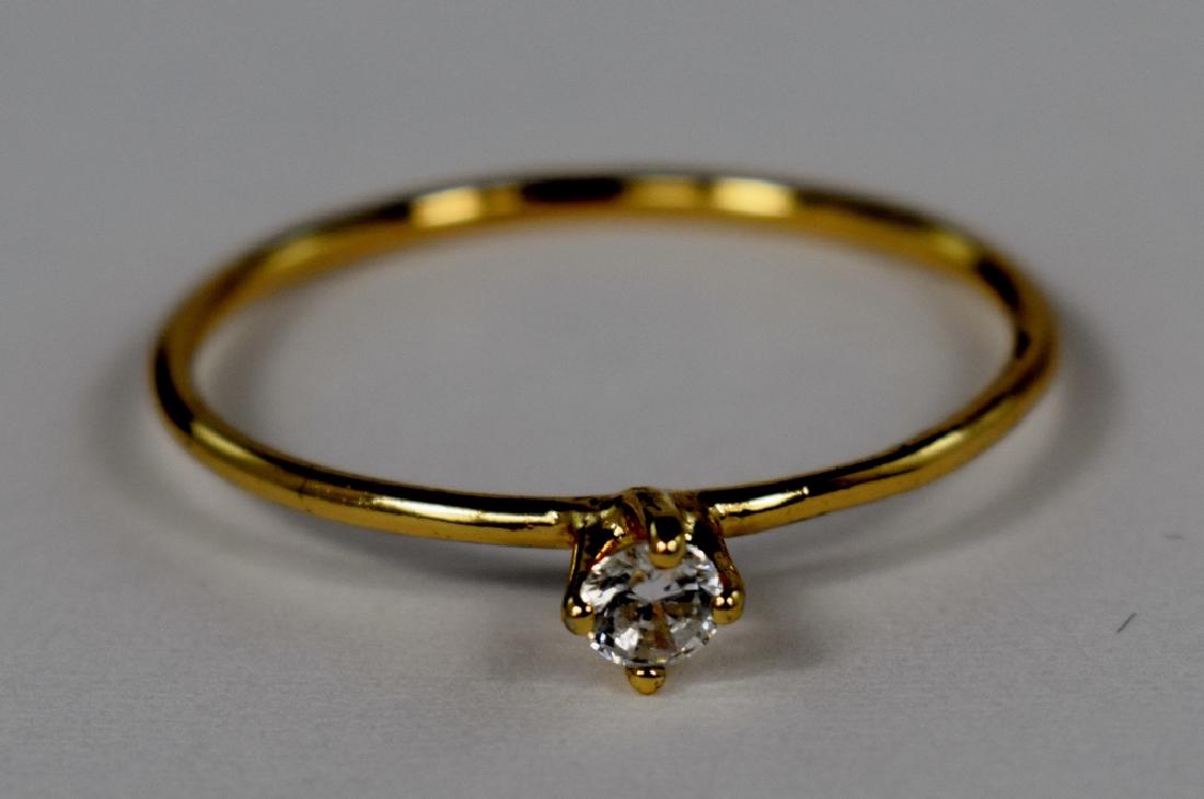 DAINTY 10K GOLD SOLITAIRE SAPPHIRE PROMISE RING: Simple 10K gold band with a 3mm white sapphire. No apparent markings, tested 10K. Ring size 8-8.5. Weighs .6g. U.S. SHIPPING $15 + INSURANCE.
