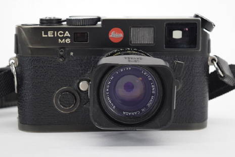 VINTAGE LEICA M6 BLACK CAMERA W/ SUMMICRON LENS: Leica M6 camera #2469472 and Summicron-M 1:2/35 Lens. While we are not camera experts and cannot guarantee all functions, this piece was maintained well, serviced properly, and is in working