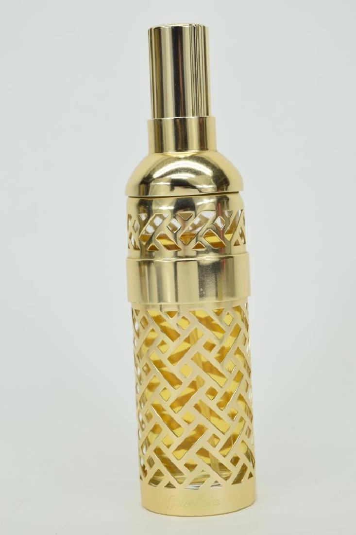 VINTAGE GUERLAIN SHALIMAR 1981 PARIS 93ML PERFUME: vintage Guerlain - Shalimar - 1981 Gold Lattice holder and Eau DeToilette Spray Bottle. The gold lattice cover is removable. 80% full. Measures 7" H. THIRD PARTY SHIPPING REQUIRED.