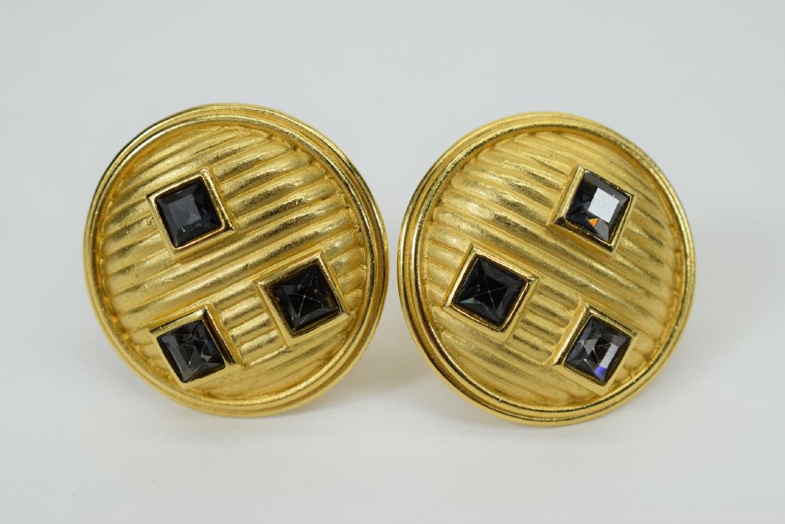 VINTAGE GUY LAROCHE FLUTED GOLD TONE EARRINGS: Pair of clip-on Guy Laroche designer costume fashion round gold tone earrings with sparkly cut glass stones. Signed Guy Laroche. Measures approx. 1-3/8” diameter. Weighs 34.2g. U.S. SHIPPING $10
