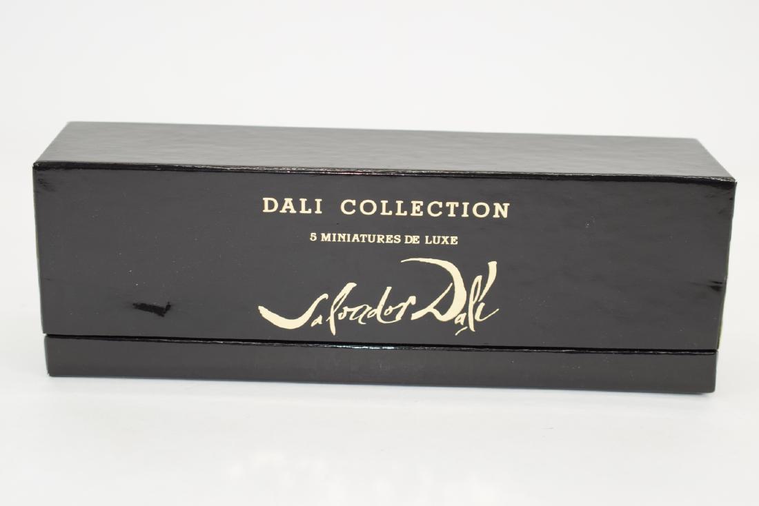 5PC MINIATURE SALVADOR DALI PERFUME SET: New old stock set including two perfumes, bath oil, soap, and cream. Black presentation box measures 9-1/4” L x 3-1/4” H x 2-1/4” D. Total weight 7.4oz. U.S. SHIPPING $20 + INSURANCE.