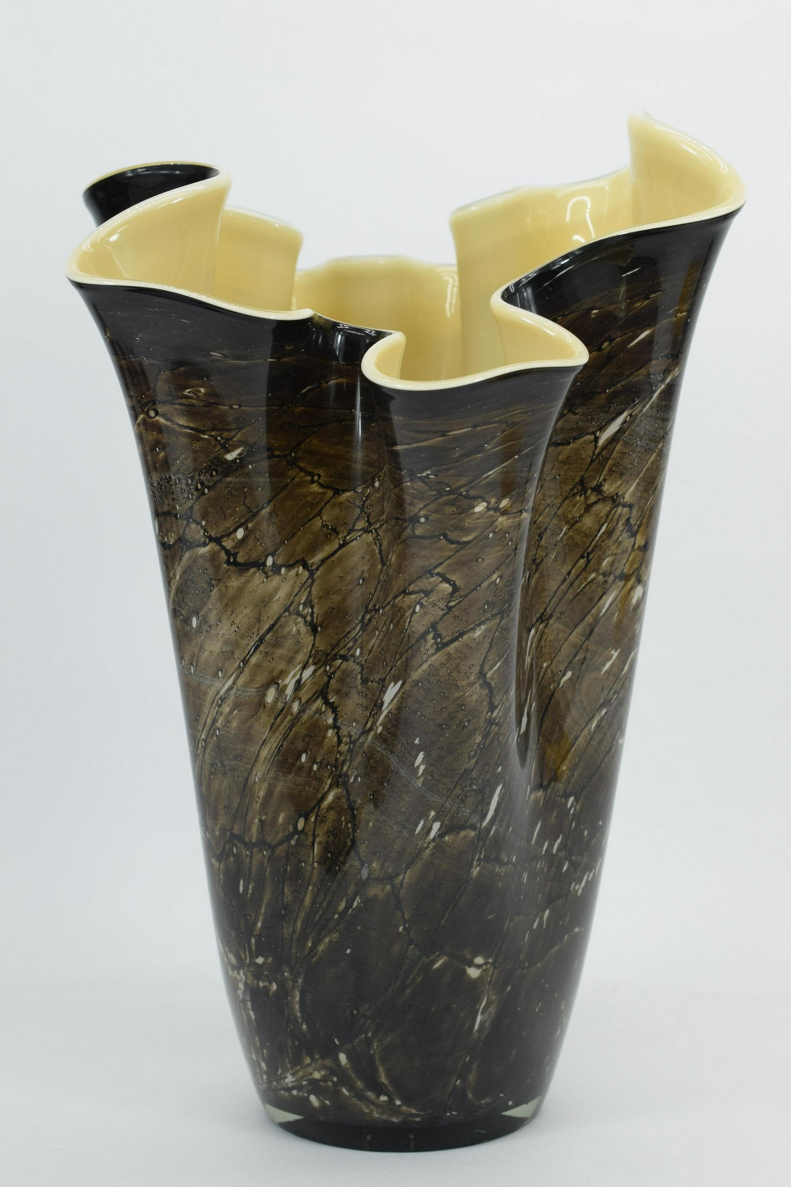 ITALIAN ART GLASS FOLDED RUFFLED VASE: Murano style black and brown art glass vase having ruffled design to top. Measures approximately 14-1/2" H x 9" W x 9-1/2" D. Weighs 5lbs2oz. THIRD PARTY SHIPPING REQUIRED