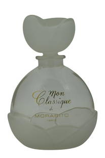 MORABITO MON CLASSIQUE FACTICE PERFUME BOTTLE: Giant designer advertising display bottle empty. Figural flower stopper. Measures approximately 9-3/4" H (7" without stopper) x 7" W x 3" D. Weighs 3lbs, 2oz.