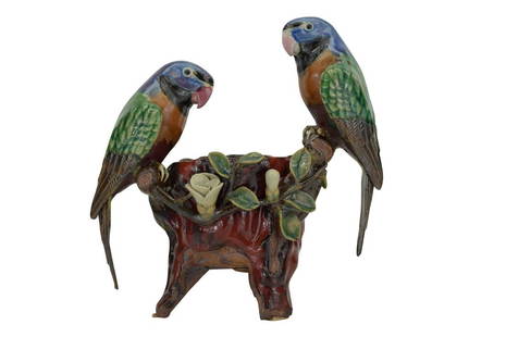 BOYUN CHINESE TERRACOTTA POTTERY PARROT PLANTER: Beautiful enamel glazed ceramic sculpture depicting two parrots or parakeet birds perched upon the branches of a plant that wraps around a bowl raised on triple feet, foliage and flowers between