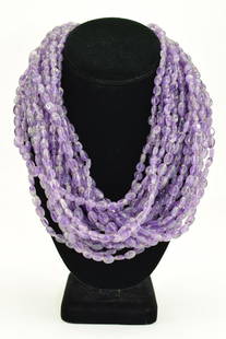 17-STRAND AMETHYST BEADED STATEMENT NECKLACE: Seventeen strands of purple amethyst polished stones ranging from 8mm to 15mm. Measures approximately 19" L (plus clasp). Weighs 1lb. U.S. PRIORITY SHIPPING $15 + INSURANCE.