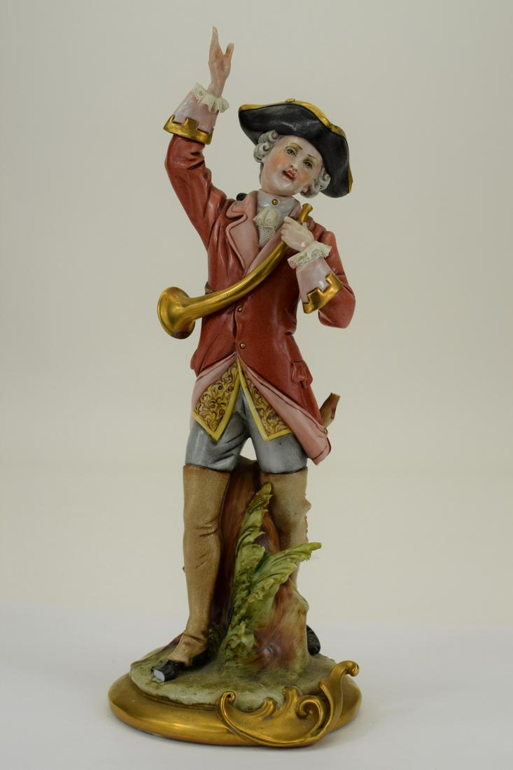 CAPODIMONTE PORCELAIN ENGLISH GENT & HORN FIGURE: Hand painted Italian porcelain figure depicting an English gentleman with a horn. Measures 10" H x 4" W x 4" D. Weighs 1lb. THIRD PARTY SHIPPING REQUIRED.