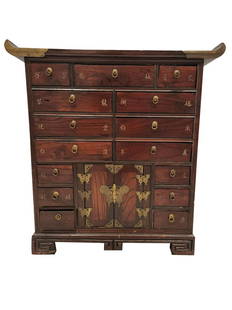 CHINESE WOODEN APOTHECARY HERBAL MEDICINE CABINET: Traditional Chinese herbal medicinal chest of drawers with brass hardware and calligraphy inlay indicators. Measures 26-3/4" H x 25-1/8" W x 11" D. THIRD PARTY SHIPPING REQUIRED.