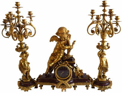 LEMERLE-CHARPENTIER CLOCK CANDELABRA GARNITURE SET: LEMERLE-CHARPENTIER CONTINENTAL MARBLE CLOCK CANDELABRA GARNITURE SET Clock marked "LEMERLE CHARPENTIER", "FANT DE BRONZES", "142", and "PARIS". Candelabra measures 30" (76.2cm) high x 10" (25.4cm) wi