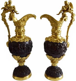 HUGE ANTIQUE NEOCLASSICAL PARCEL GILT BRONZE EWERS: HUGE ANTIQUE NEOCLASSICAL PARCEL GILT BRONZE EWERS "A large pair of French 19th Century Napoleon III style ormolu & patinated bronze ewers. On round bases with scenes of cherubs throughout. The ormolu