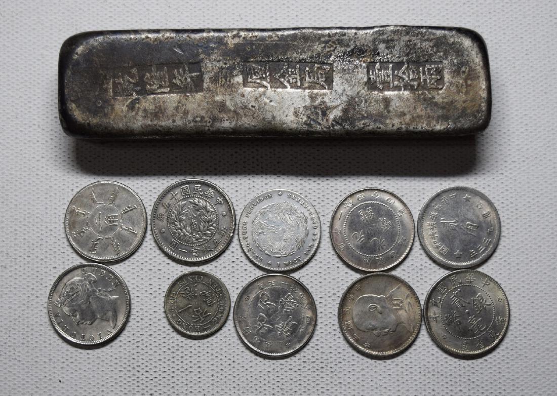 ONE CHINESE SILVER INGOT AND TEN COINS (1 of 2)