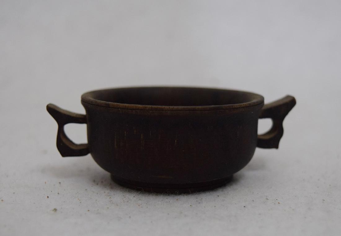 CHINESE ZITAN CRAVED TWO HANDLES CUP: CHINESE ZITAN CRAVED TWO HANDLES CUP. Diam. 8 cm. Domestic shipping $20 and oversea $40. Combined shipping available. We accept pre-sale offer, phone bidding and post sale offer. For buyers from China