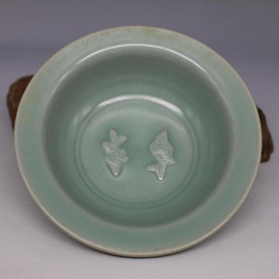 CHINESE PORCELAIN CELADON GLAZE FISH PLATE: CHINESE PORCELAIN CELADON GLAZE FISH PLATE. Diam. 13 cm. Domestic shipping $40 and oversea $80. Combined shipping available. We accept pre-sale offer, phone bidding and post sale offer. For buyers fro