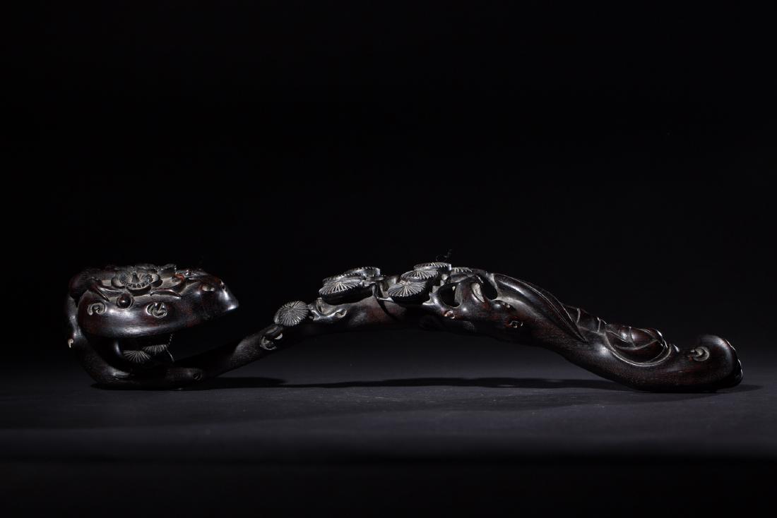 CHINESE ZITAN CRAVED RUYI: CHINESE ZITAN CRAVED RUYI. L. 28.5 cm. W. 8.3 cm. T. 7.5 cm. Domestic shipping $20 and oversea $40. Combined shipping available. We accept pre-sale offer, phone bidding and post sale offer.