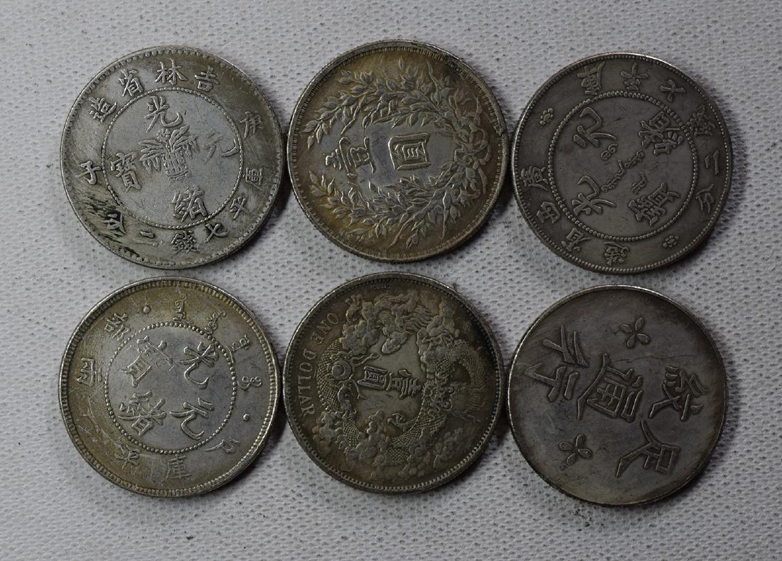 SIX CHINESE DOLLAR COINS (1 of 3)