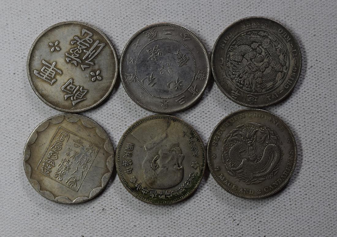 SIX CHINESE DOLLAR COINS (1 of 3)