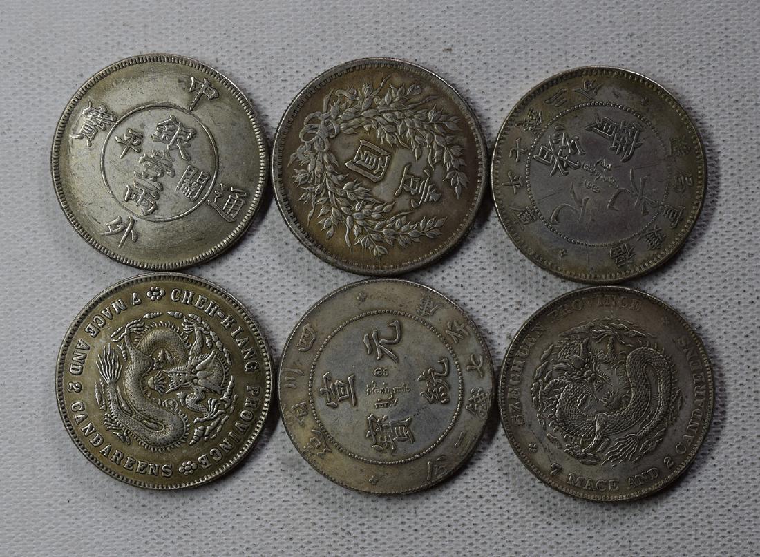 SIX CHINESE DOLLAR COINS (1 of 3)