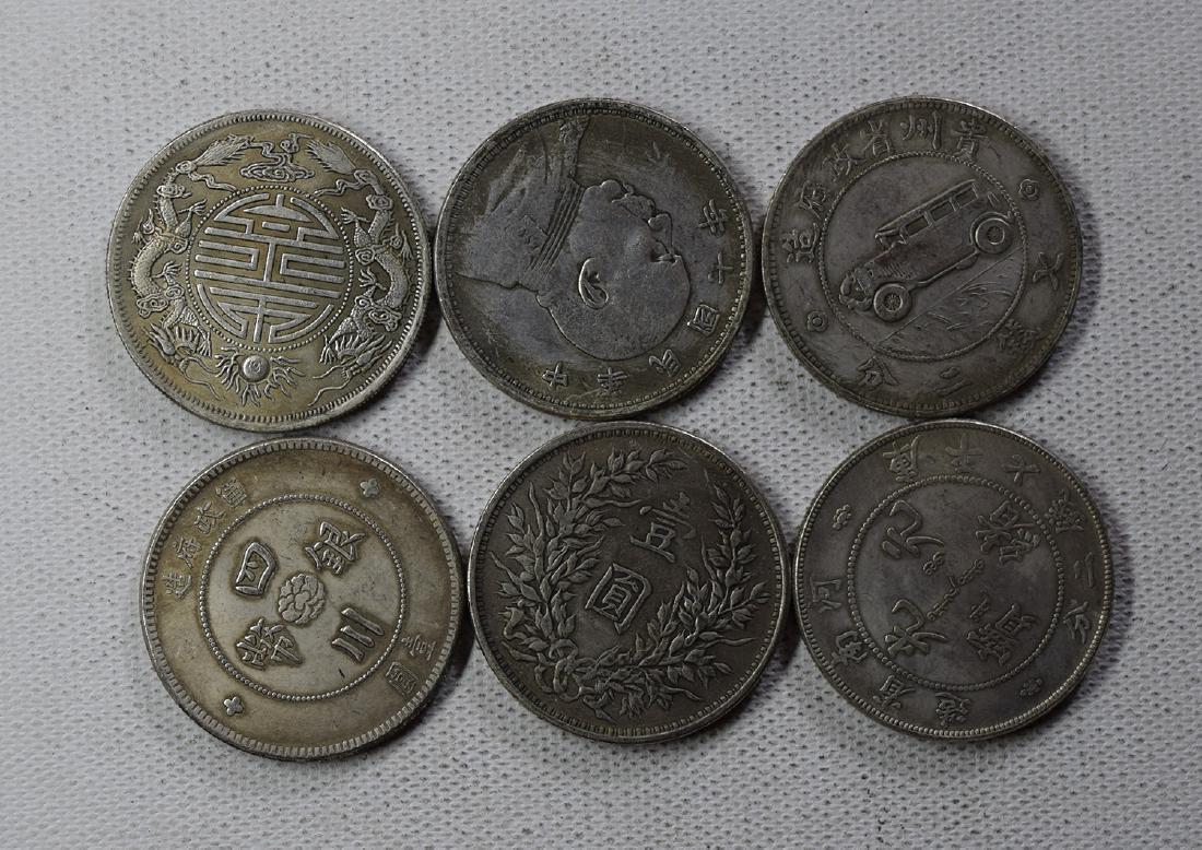 SIX CHINESE DOLLAR COINS (1 of 3)