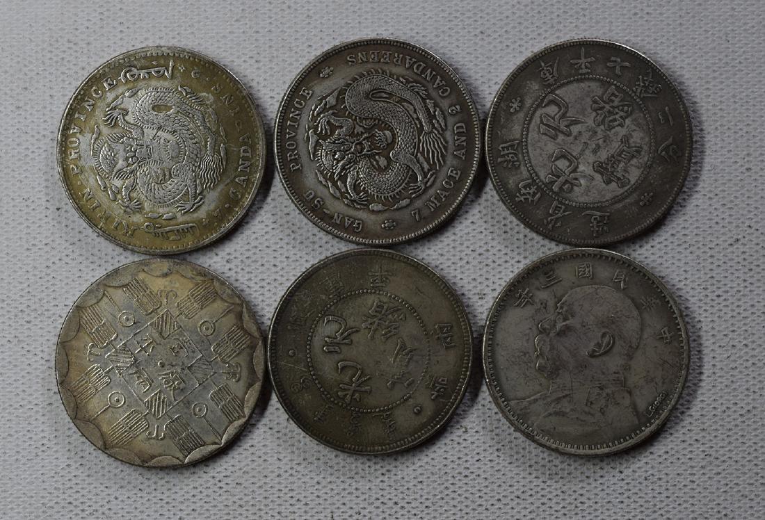 SIX CHINESE DOLLAR COINS (1 of 3)