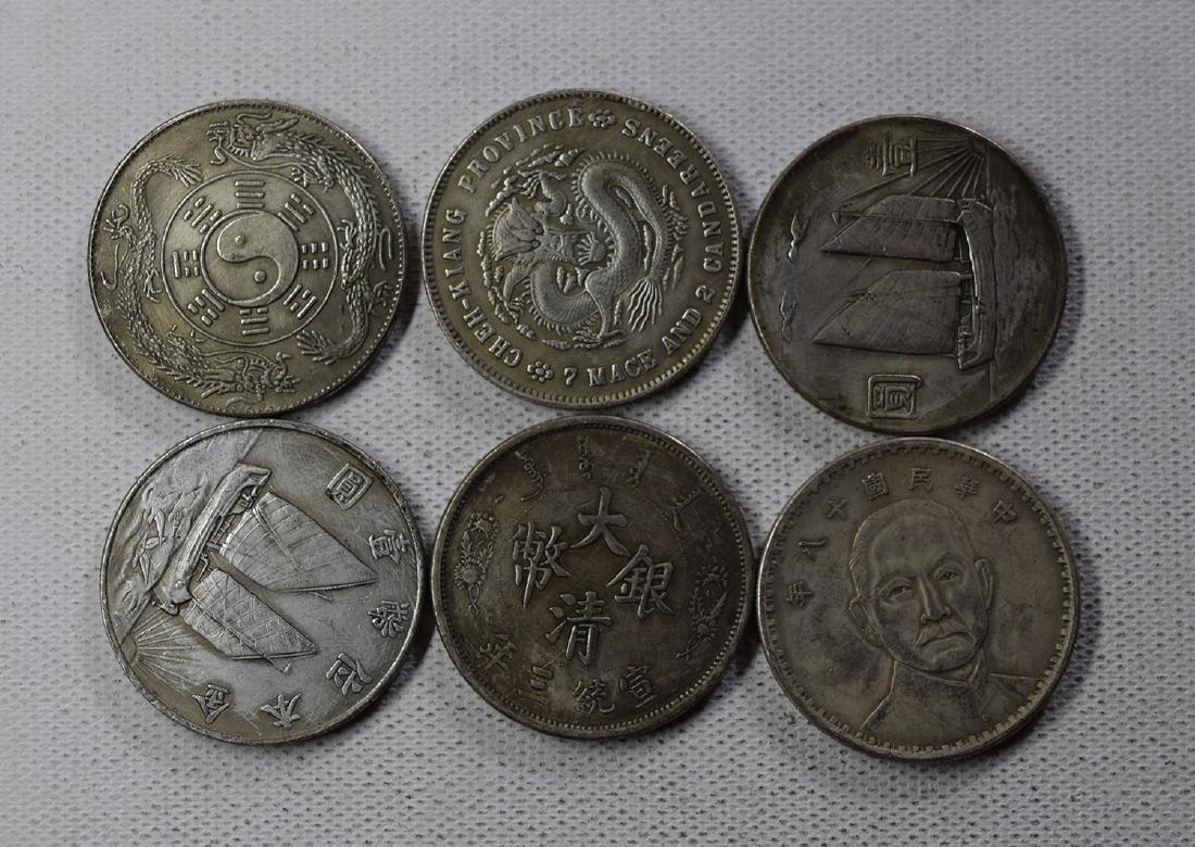 SIX CHINESE DOLLAR COINS: SIX CHINESE DOLLAR COINS. Each weight around 26.5 gram. Domestic shipping $5 and oversea $10. Combined shipping available. We accept pre-sale offer, phone bidding and post sale offer. For buyers from 