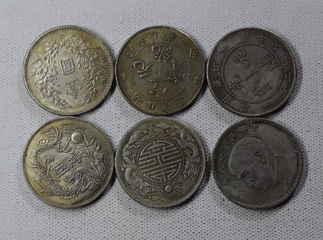 SIX CHINESE DOLLAR COINS: SIX CHINESE DOLLAR COINS. Each weight around 26.5 gram. Domestic shipping $5 and oversea $10. Combined shipping available. We accept pre-sale offer, phone bidding and post sale offer. For buyers from 