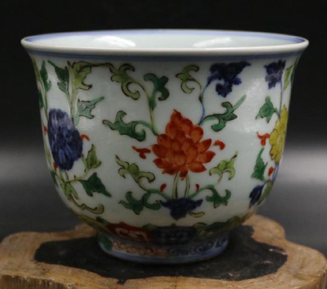 CHINESE PORCELAIN WUCAI FLOWER CUP: CHINESE PORCELAIN WUCAI FLOWER CUP. Six character marker on bottom. H. 13 cm. Diam. 16 cm. Domestic shipping $20 and oversea $40. Combined shipping available. We accept pre-sale offer, phone bidding a