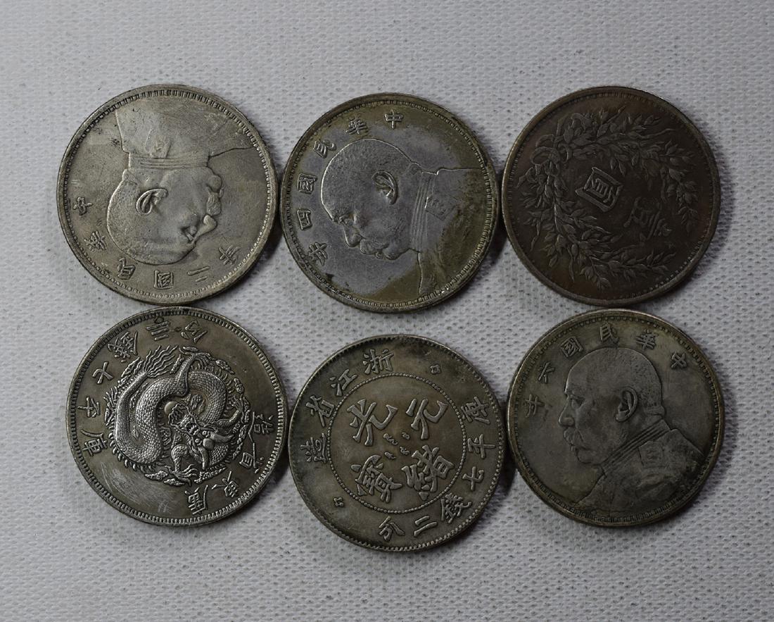 SIX CHINESE DOLLAR COINS: SIX CHINESE DOLLAR COINS. Each weight around 26.5 gram. Domestic shipping $5 and oversea $10. Combined shipping available. We accept pre-sale offer, phone bidding and post sale offer. For buyers from 