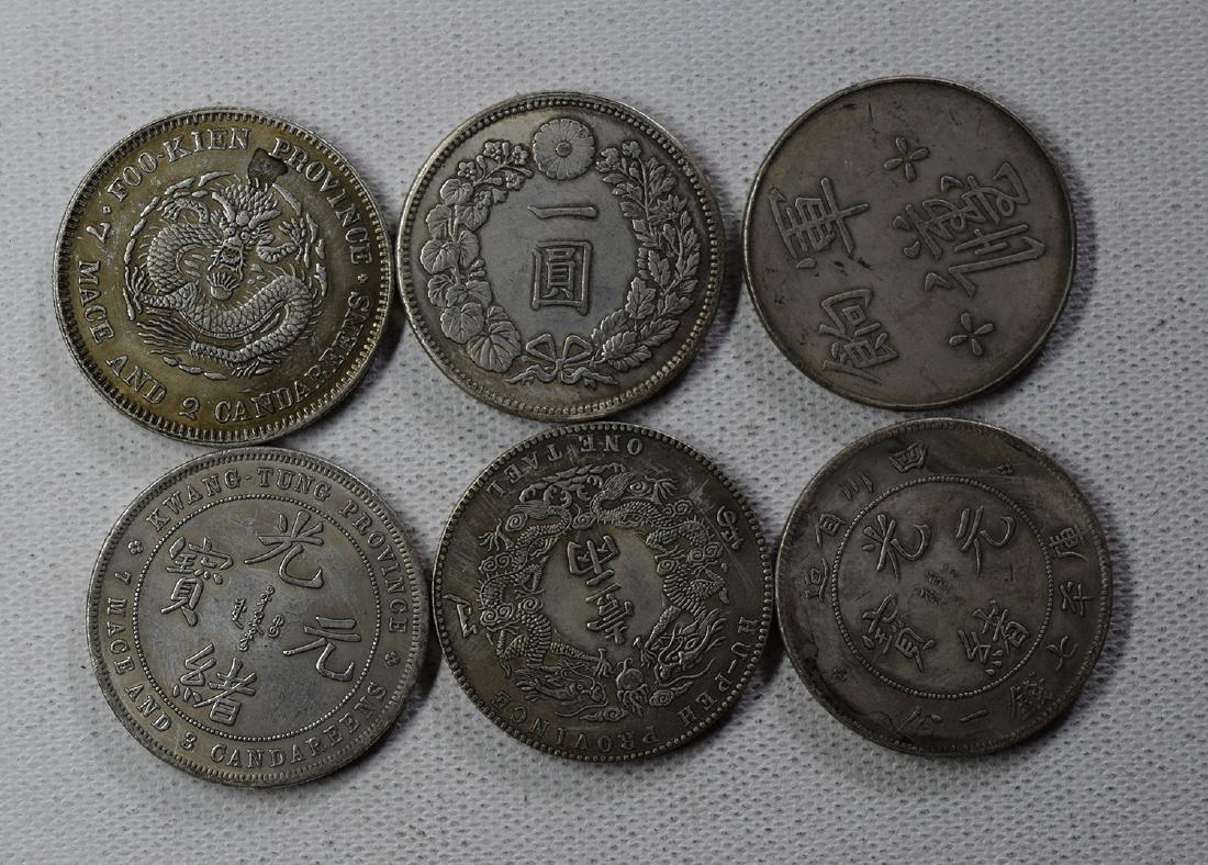 SIX CHINESE DOLLAR COINS: SIX CHINESE DOLLAR COINS. Each weight around 26.5 gram. Domestic shipping $5 and oversea $10. Combined shipping available. We accept pre-sale offer, phone bidding and post sale offer. For buyers from 