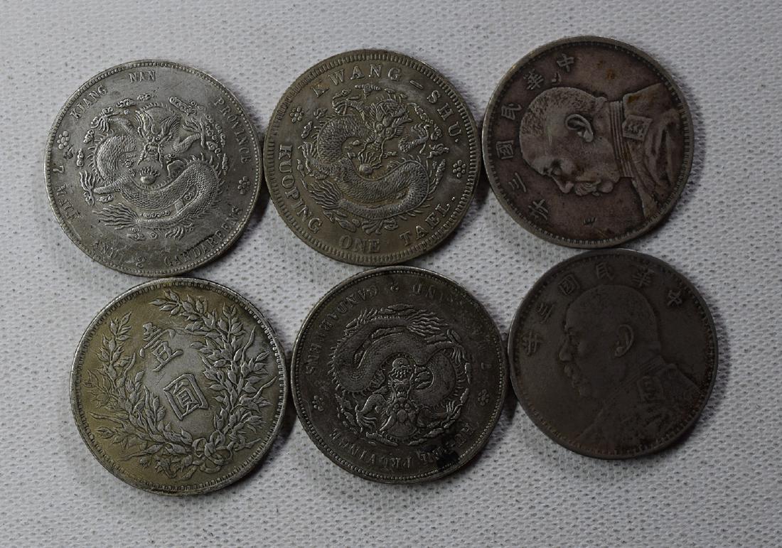 SIX CHINESE DOLLAR COINS: SIX CHINESE DOLLAR COINS. Each weight around 26.5 gram. Domestic shipping $5 and oversea $10. Combined shipping available. We accept pre-sale offer, phone bidding and post sale offer. For buyers from 
