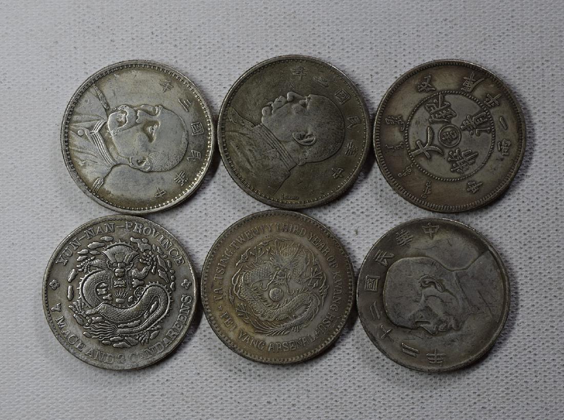 SIX CHINESE DOLLAR COINS (1 of 3)